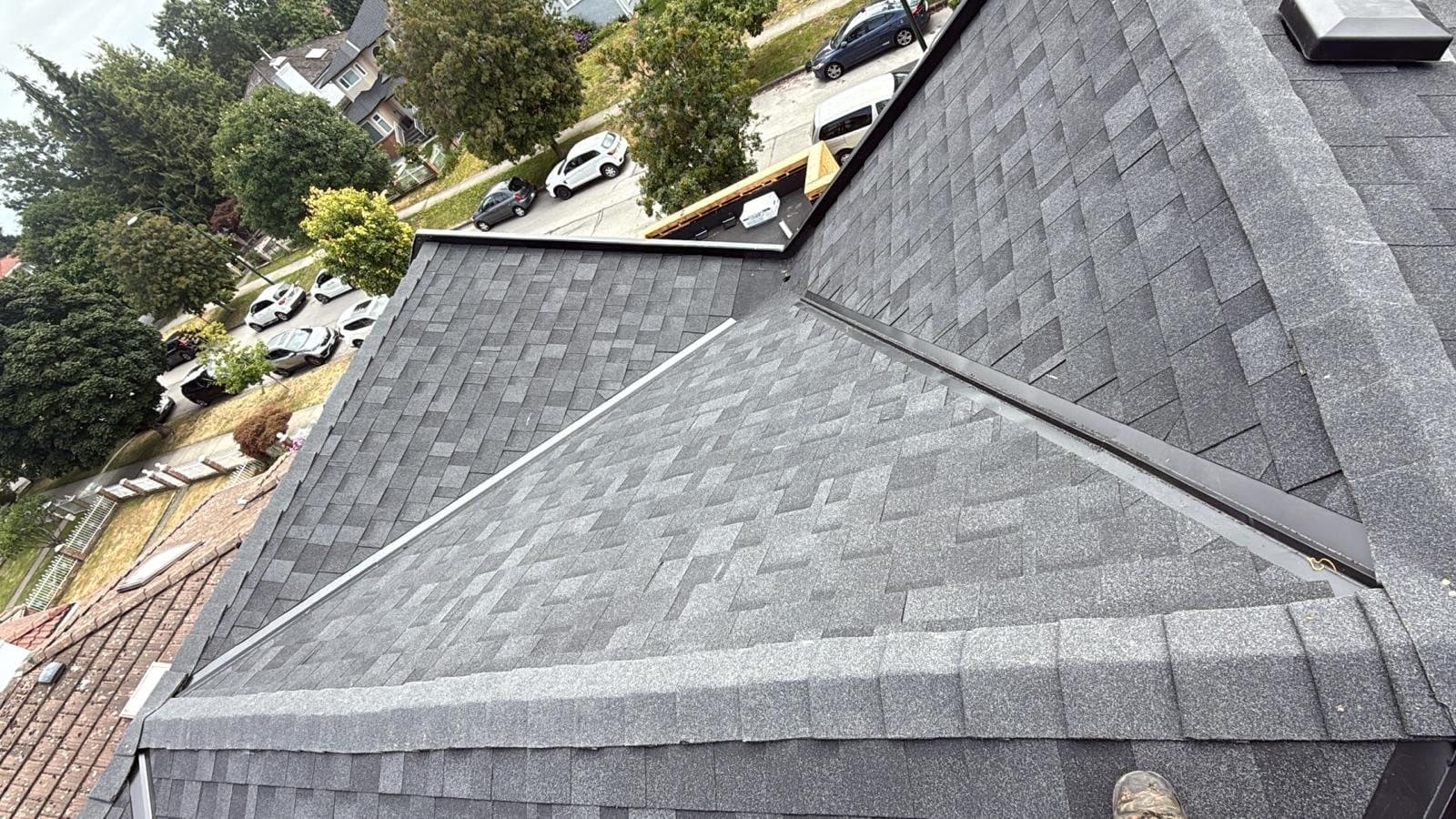 Drone shot of a Langley home we just re-shingled, clean architectural asphalt lines and fresh ridge cap